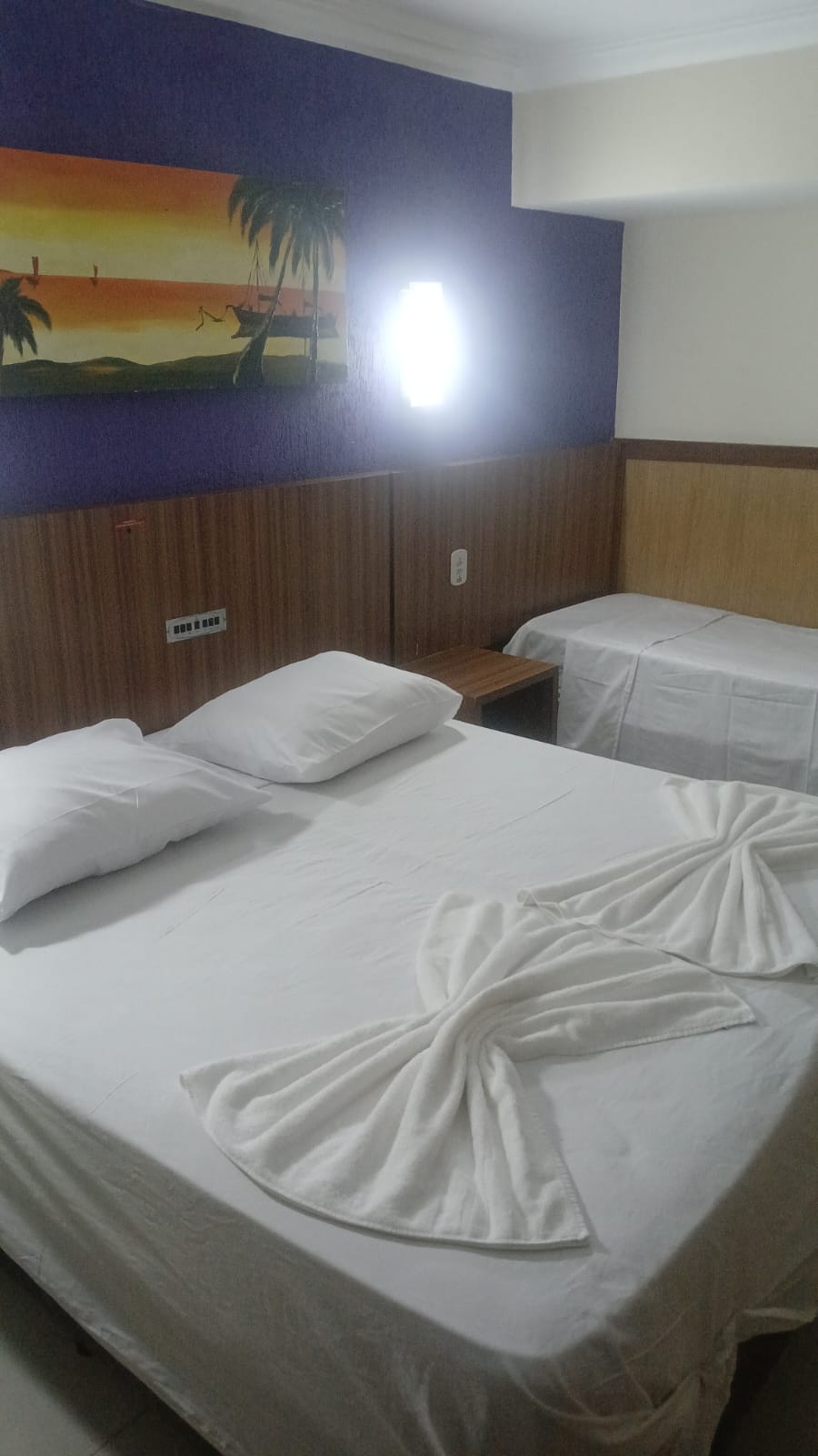 Cama casal do Happy Hotel Ancoradouro